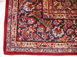 Border Elegance - Persian Isfahan Rug Border: Admire the detailed border of this 9'8 x 13'7 Persian Isfahan rug, a testament to the rug maker's dedication to perfection