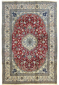 Full view of red Persian Nain 9LA rug showing detailed medallion design, ivory borders, and fine wool and silk weave