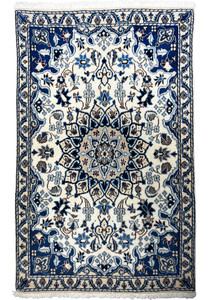 Full view of 2'11" x 4'6" Persian Nain wool and silk rug with floral medallion.