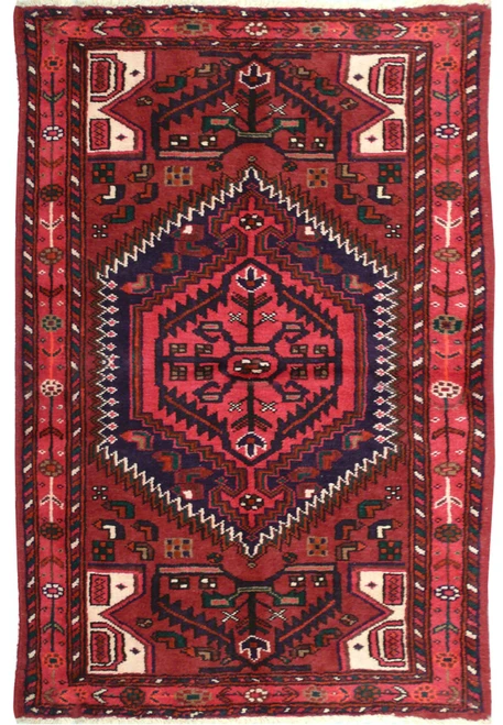3'3" x 5'1" Persian Hamedan rug with red field, navy hexagonal medallion and ivory corner panels