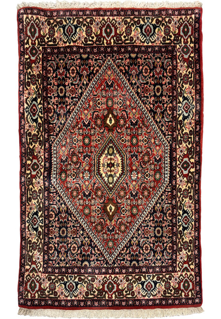 Experience opulence with our Bijar rug, showcasing a mesmerizing 3x5 size. Its rich colors and intricate motifs add a touch of Persian elegance to any room