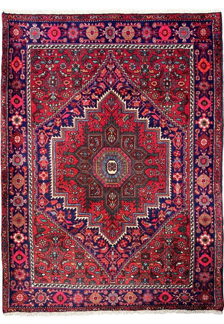 Full view of a 3'4" x 4'8" Persian Gholtogh rug with a navy blue base and intricate crimson medallion centerpiece, perfect for luxury home decor