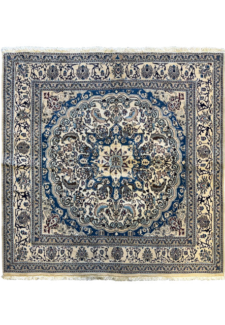 Overhead view of a 6'3 x 6'7 Persian Nain Square Rug featuring intricate blue and ivory floral patterns with a central medallion.