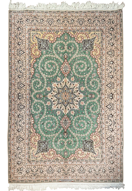 5'2 x 8 Persian Isfahan wool and silk rug with green field and medallion design