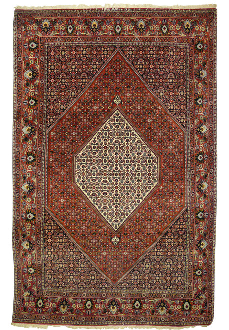 Full view of 6'9 x 9'4 Bijar Persian Iron Rug showing central ivory medallion on red field with navy floral borders