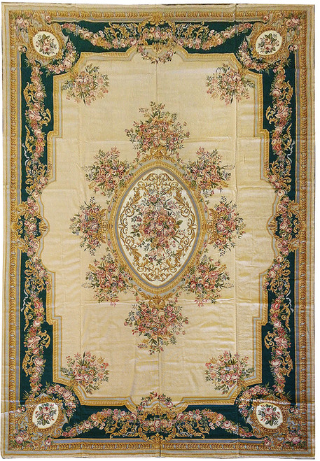 Full view of an 11'4 x 18 French Aubusson rug with beige field, emerald green floral border, oval medallion, and classical rose garland design
