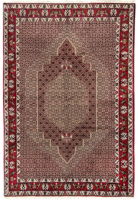 Full view of a 7'4 x 9'8 Persian Senneh rug with deep burgundy field, dense geometric patterning, stepped medallion, and ivory outlined motifs