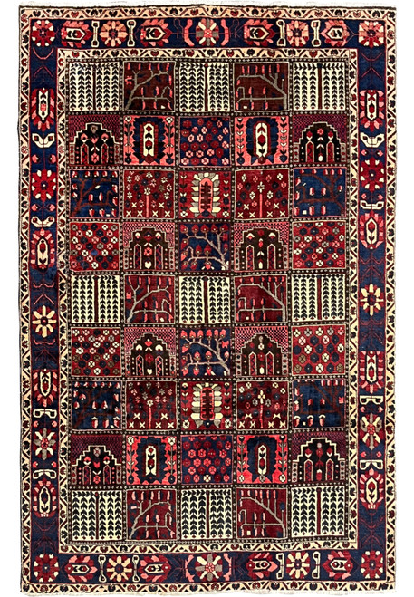 Hand-knotted 7x10 Persian Bakhtiari wool rug with red and navy panel design, full view