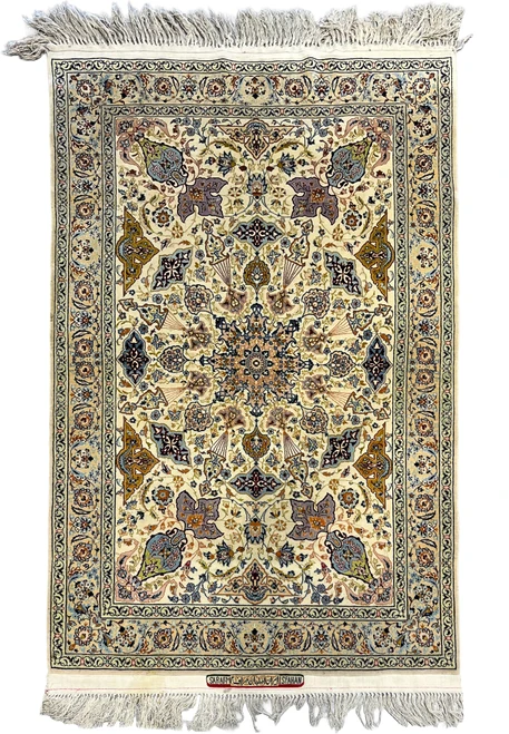 Authentic 4x6 Persian Isfahan rug signed by master weaver Sarraf Mamoury with ivory field and floral medallion
