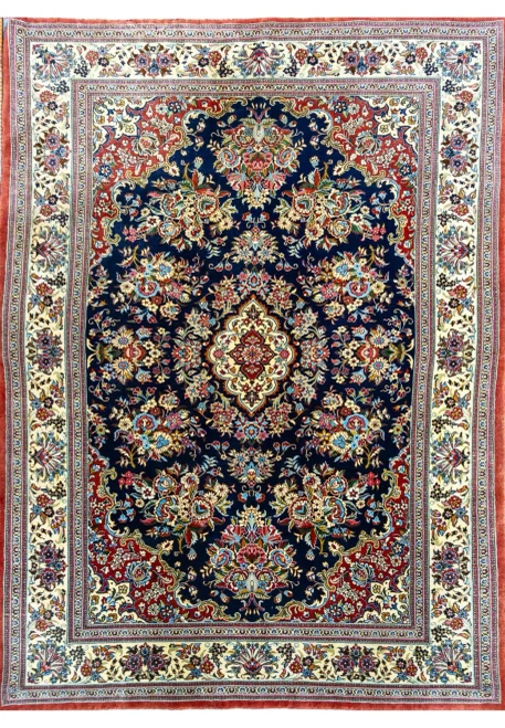 Authentic 4'5 x 6'8 Persian Qum kork wool rug full view with floral medallion and bouquets on midnight navy field