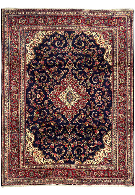 Full overhead view of 10x13 Persian Qum kork wool rug, midnight navy field with crimson border and layered floral medallion