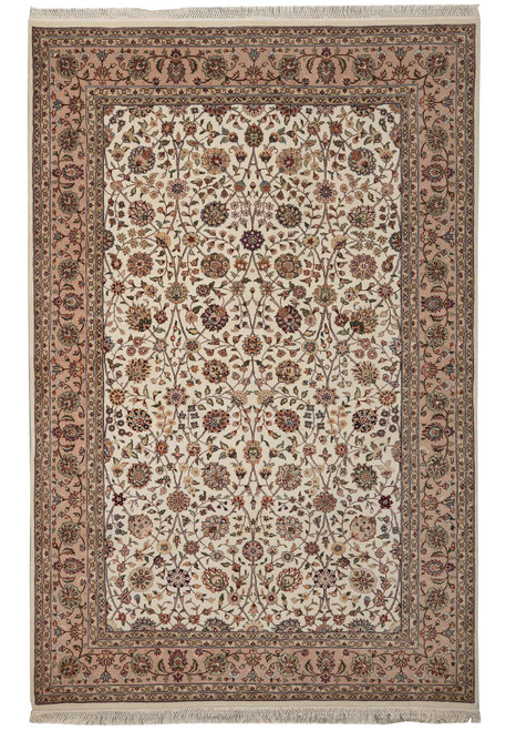 Full overhead view of the ivory Tabriz-design rug with tan floral border and ivory fringes
