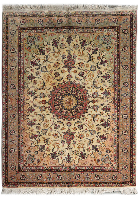 Full overhead view of the ivory Tabriz rug with coral star medallion and rose-brown border