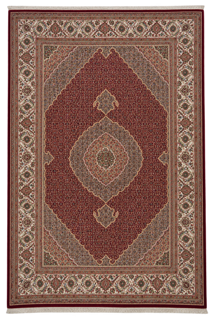 Full overhead view of the red Tabriz Mahi rug with pale oval medallion and ivory floral border