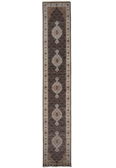 Full-length overhead view of the black-ground Tabriz Mahi runner with five ivory medallions end to end