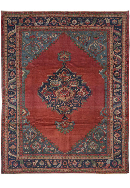 Full view of 10' x 12'9" Turkish Serapi rug with coral red field and navy medallion