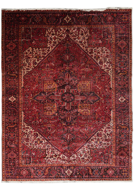 Full view of 11'2" x 14'7" Persian Heriz rug with brick red field and geometric medallion