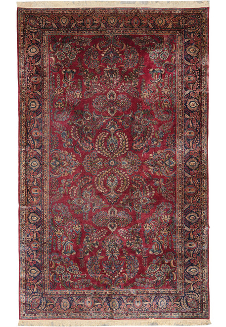 Full overhead view of 10 x 16 antique Persian Sarough rug with mahogany field and navy border