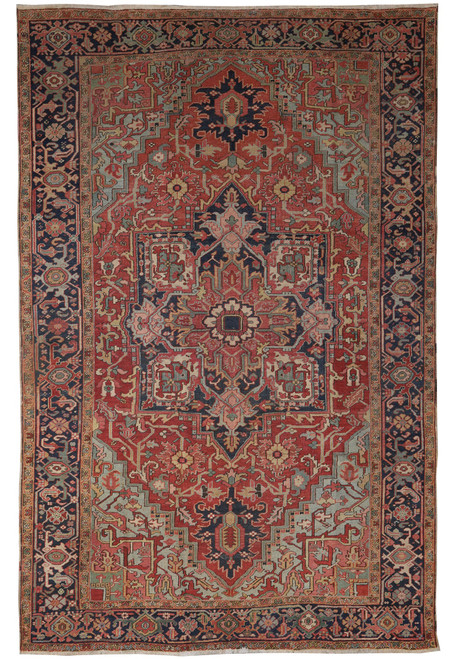 8'2" x 12'2" antique Persian Heriz Serapi rug shown flat with rust field and navy border