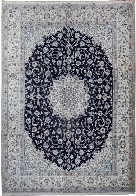 Full view of navy blue and ivory Persian Nain rug with star medallion and floral border