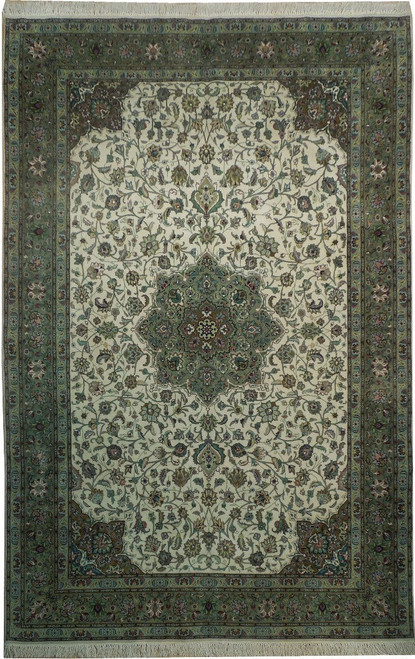 Overhead view of ivory and green Persian Tabriz rug with floral medallion and sage border