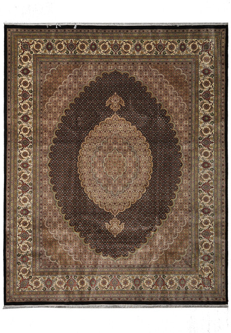 Black field Mahi Tabriz rug with ivory oval medallion and allover herati fish pattern