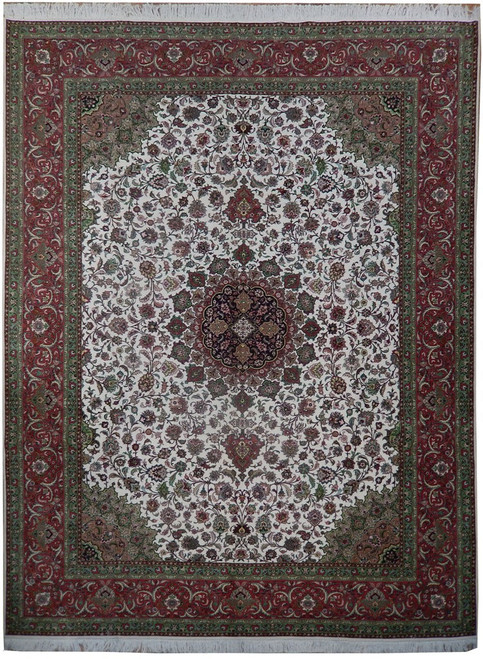 Full overhead view of ivory 10x13 Persian Tabriz rug with coral border and indigo medallion