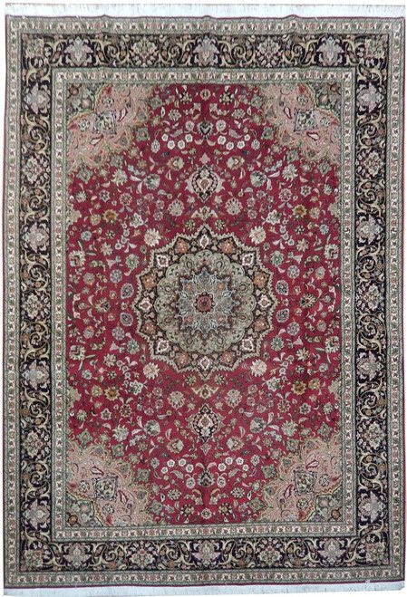Ruby red Persian Tabriz rug with sage green floral medallion and deep navy arabesque border