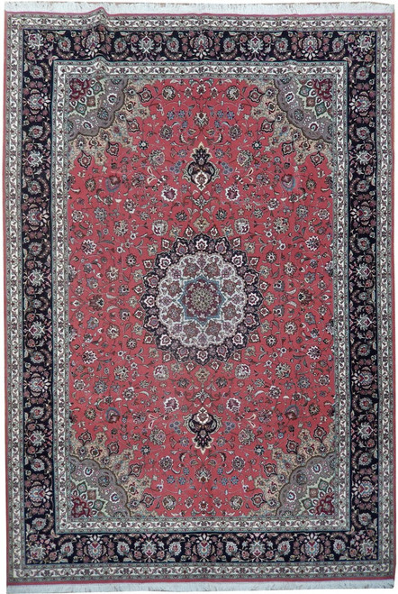 Soft coral Persian Tabriz rug with ivory lobed medallion, black floral border and dense wool silk pile