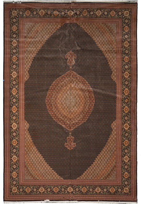 Overhead view of dark brown Persian Tabriz Mahi rug with scalloped central medallion and floral border