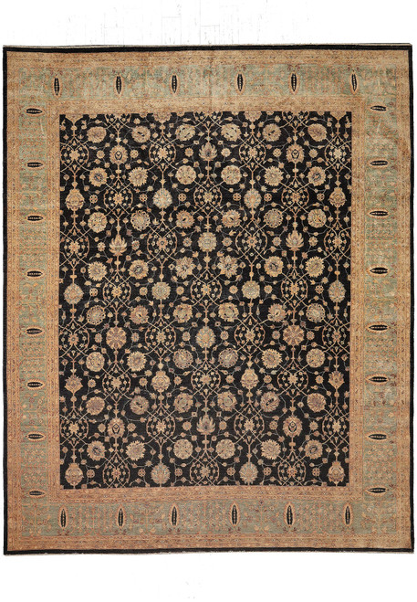 Full overhead view of black Ziegler Chobi wool rug with sage green floral border