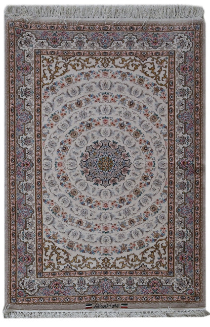 Ivory Persian Isfahan rug with navy floral medallion and concentric vine rings, full overhead view
