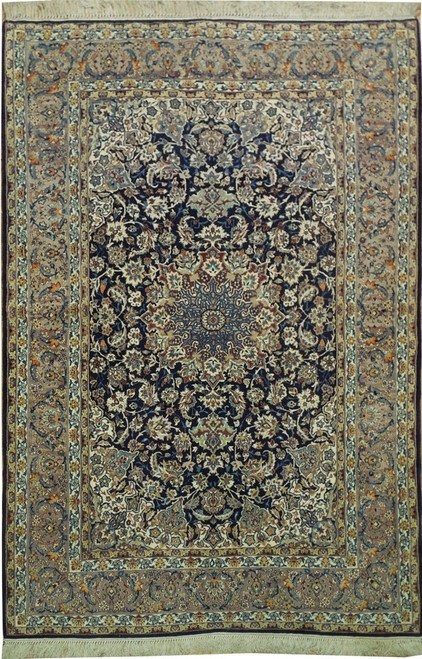 Full view of navy Persian Isfahan rug with gray border, rust medallion and ivory floral field