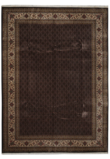 Full overhead view of black Mahi Herati Oriental rug with ivory palmette border and fringe