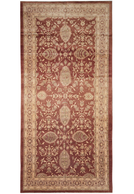 Full view of 9'3" x 18' oversize Agra design rug with rust field and ivory border