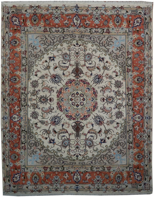 Full view of ivory and coral Persian Tabriz rug with central floral medallion and scrolling vines