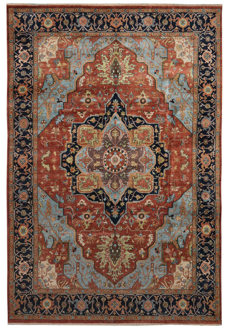 Full overhead view of rust and navy Serapi rug with geometric star medallion and floral border
