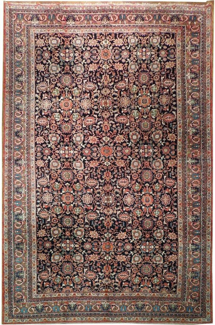 Full overhead view of Persian Mahal rug with black field, rose border and all over palmettes