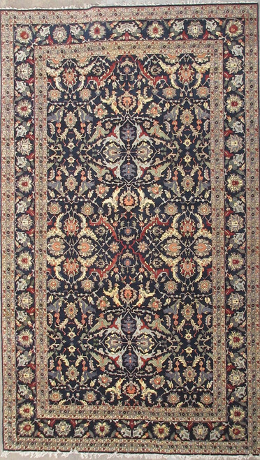 Full overhead view of 15'9" x 25' navy blue Soltanabad rug with cream floral borders