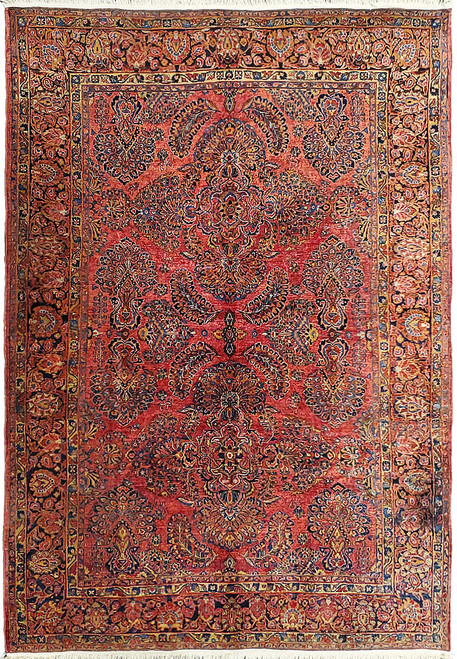 Antique red Persian Sarouk rug with all-over floral sprays, navy palmettes and gold framed border