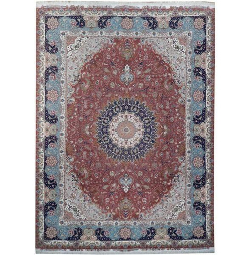 Rust and navy Persian Tabriz rug with sky blue floral border, shown flat overhead
