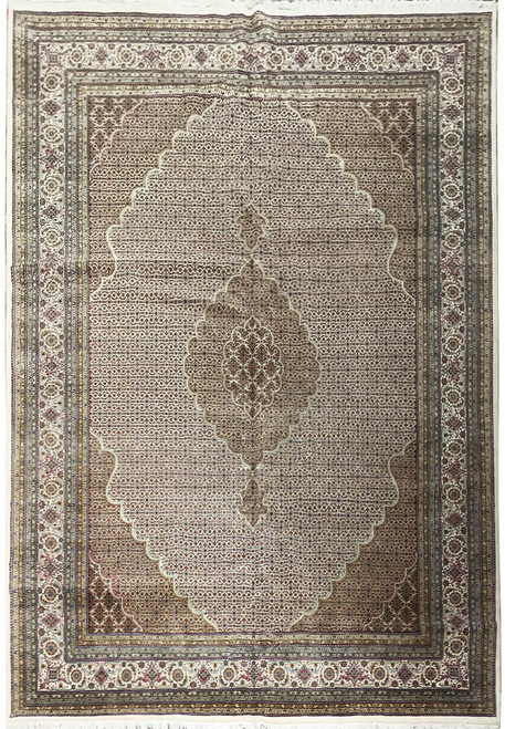 Ivory Tabriz Mahi design rug with scalloped medallion and dense herati fish field pattern