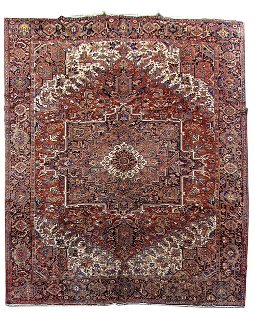 Full overhead view of 11x14 Persian Heriz rug with brick red field and ivory spandrels