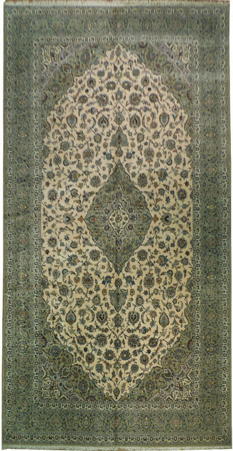 Full overhead view of a greenish ivory Persian Kashan rug with sage green floral borders