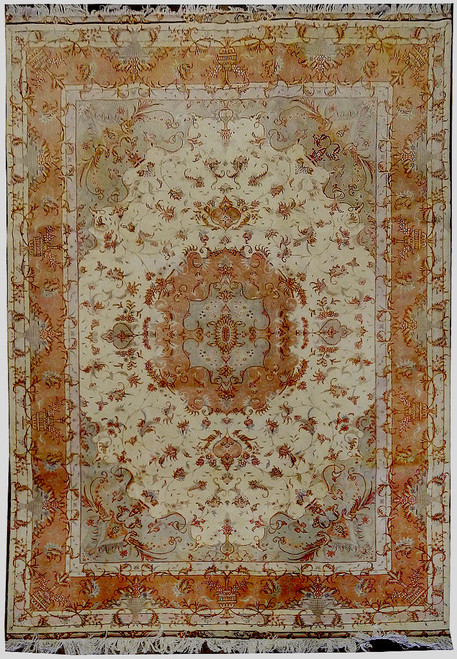 Full view of Persian Tabriz rug with cream field, peach medallion and coral floral border