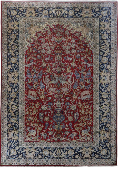 Dark red Persian Isfahan rug with animal and vine field framed by navy blue floral border
