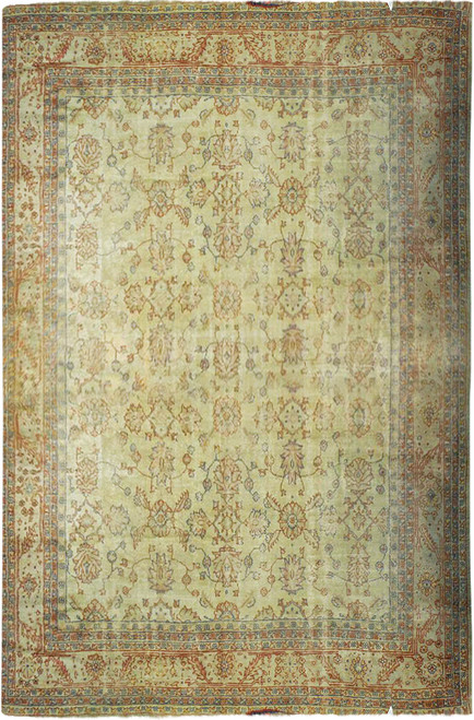 Full overhead view of ivory and sage Oushak design rug with all over floral pattern