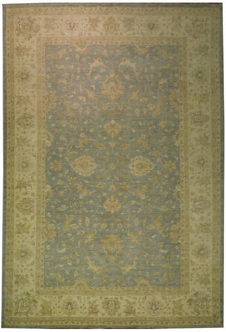 Full view of the Ziegler rug, soft blue field enclosed by a wide ivory floral border
