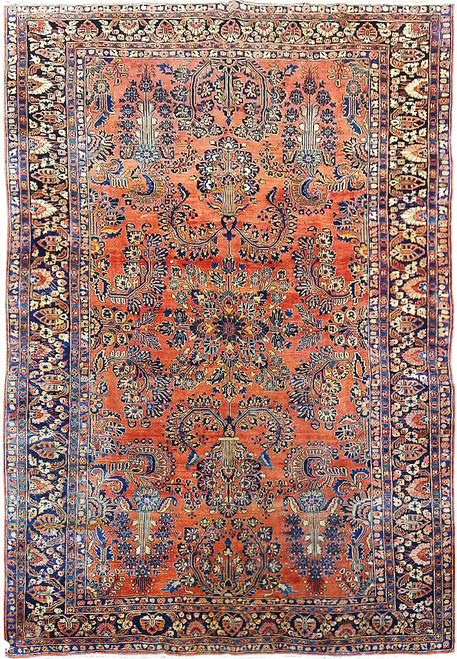 Full overhead view of antique Persian Sarough rug, coral red field and deep navy floral border
