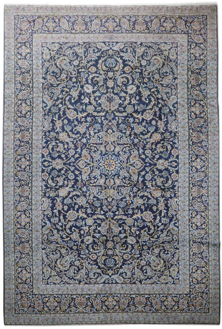 Full overhead view of navy blue 9x13 Persian Kashan rug with light blue floral border